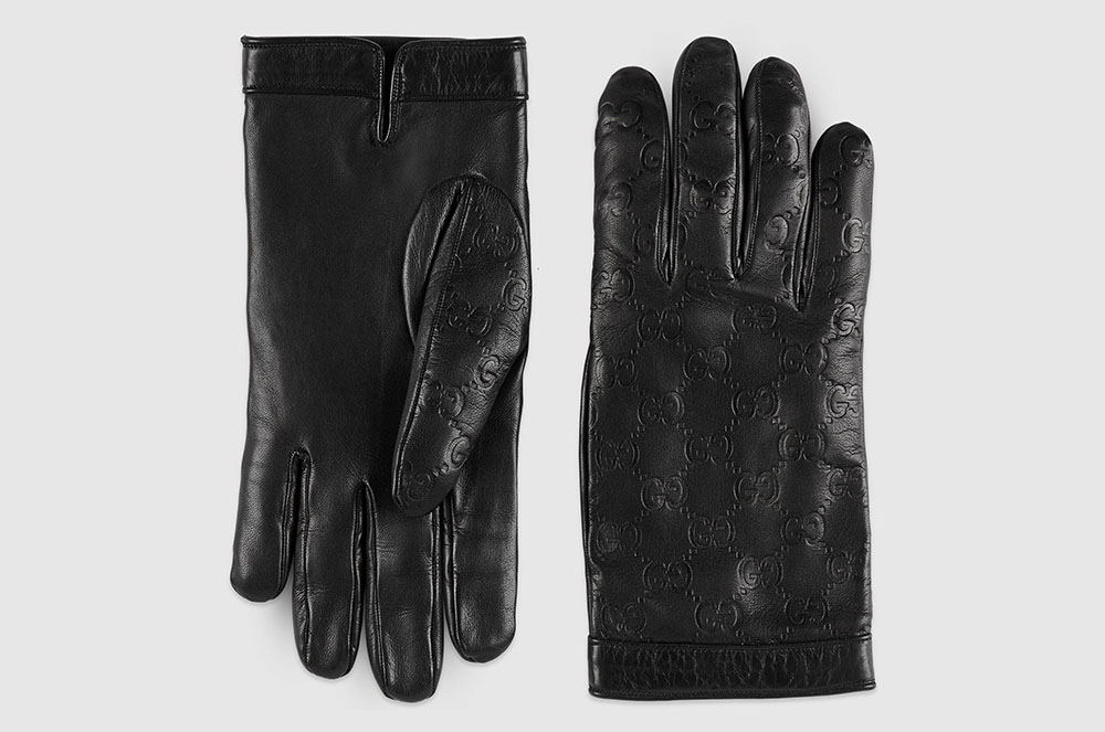 Guants de pell negre amb estampat de la casa GUCCI