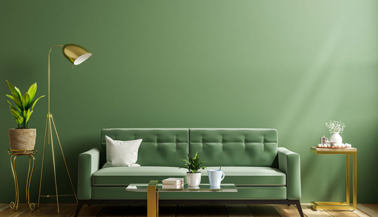 Luxury living room wall mockup with green sofa and decor on dark
